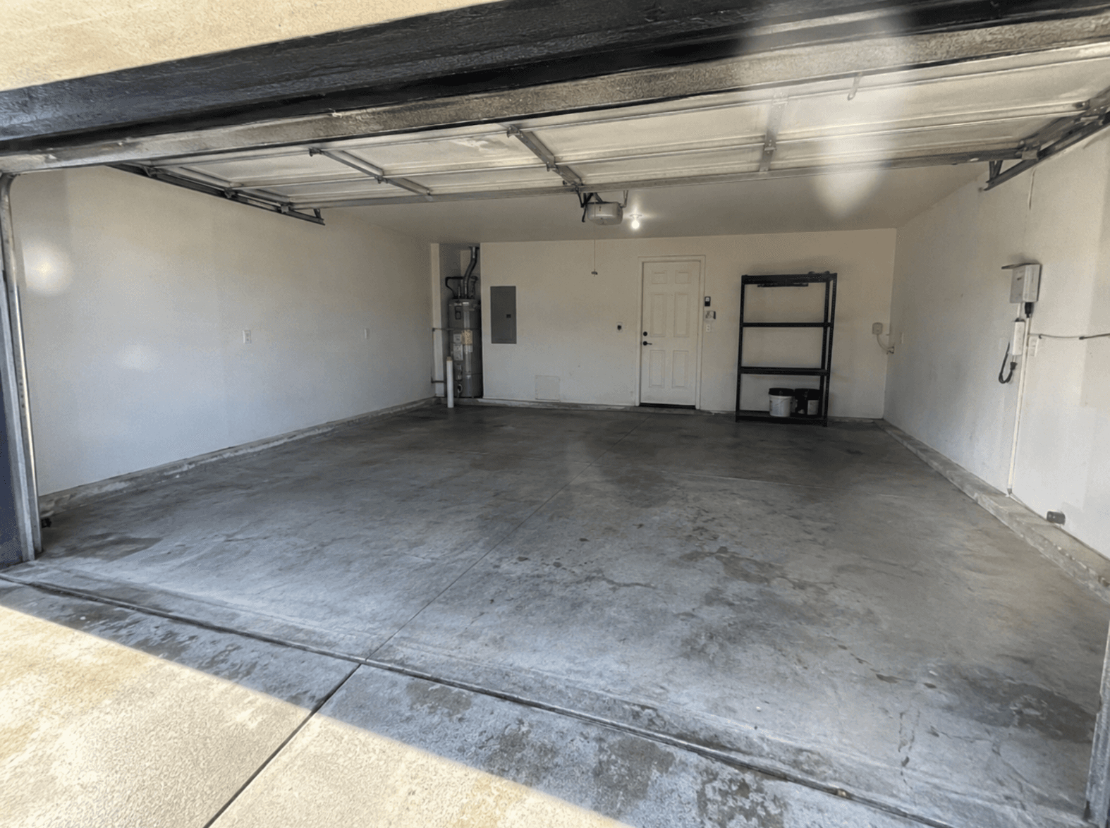 The garage cleared to a bare concrete floor