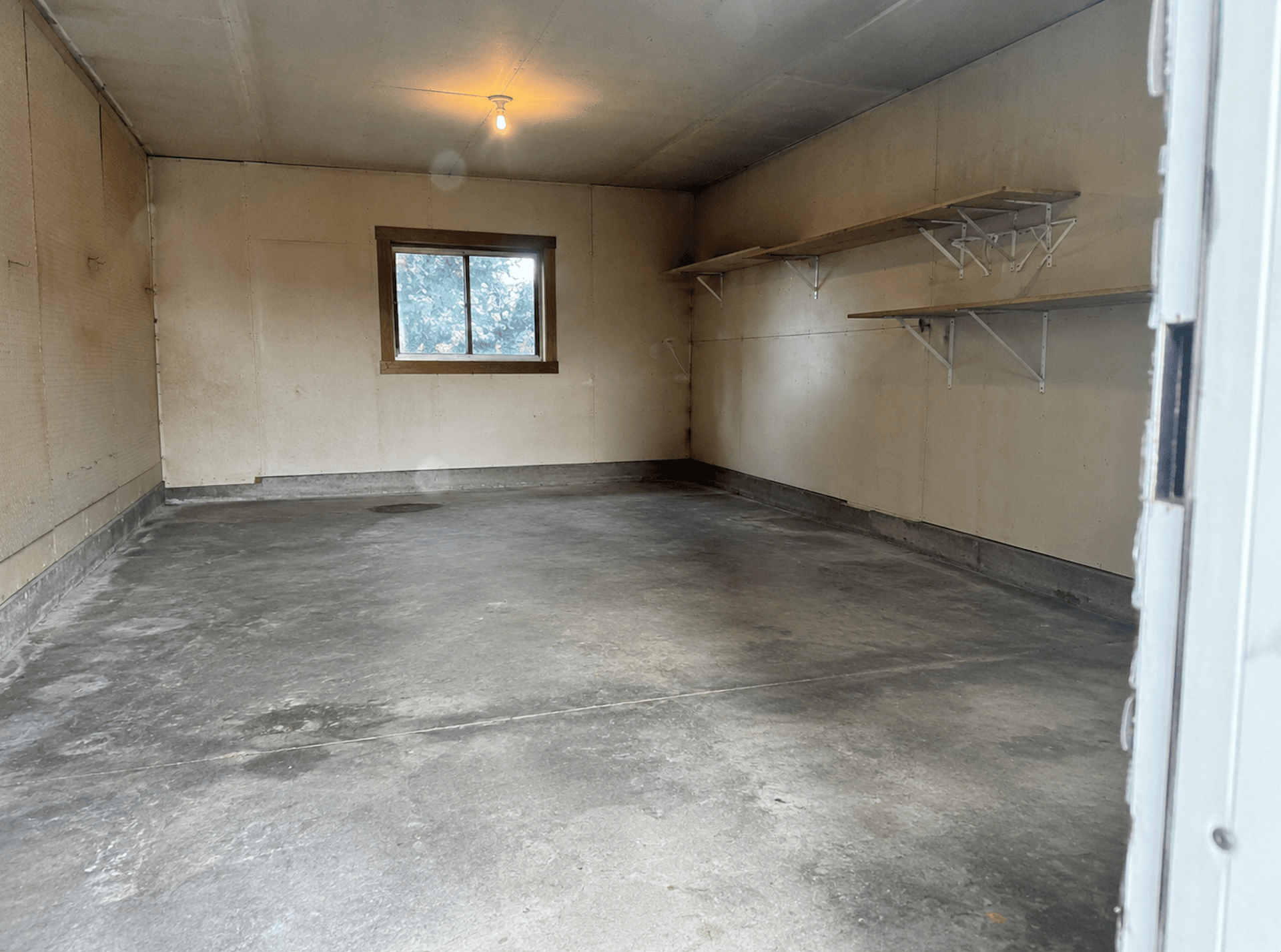The storage room emptied, with bare shelves on the wall