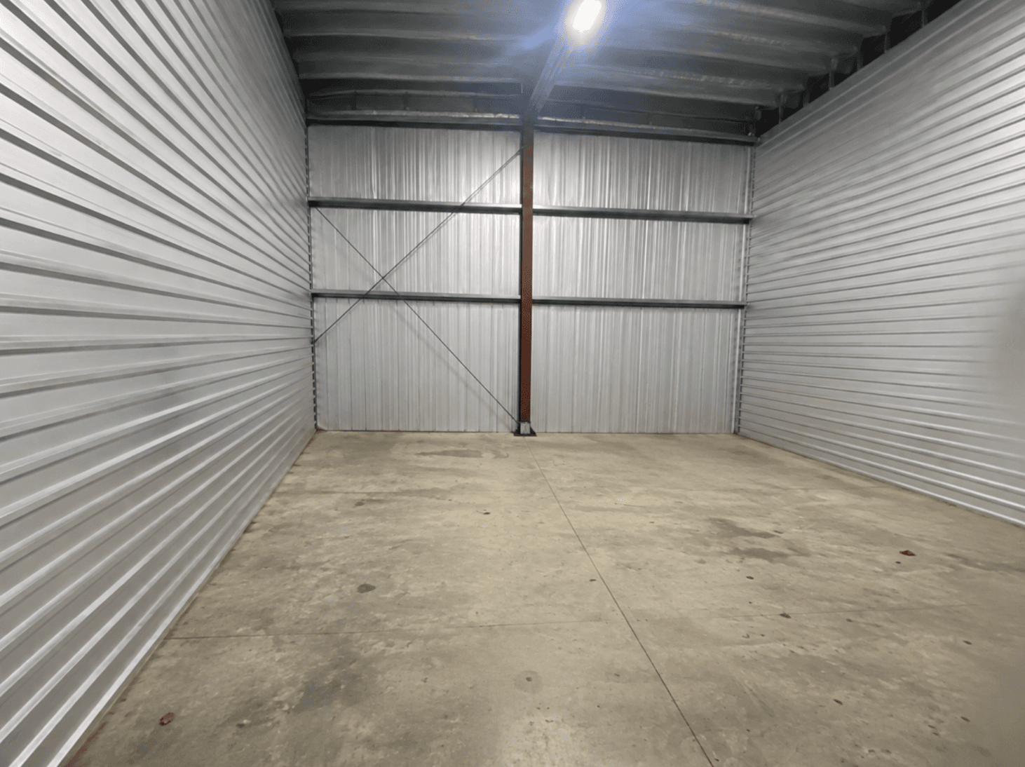 The storage unit emptied to its bare walls and floor